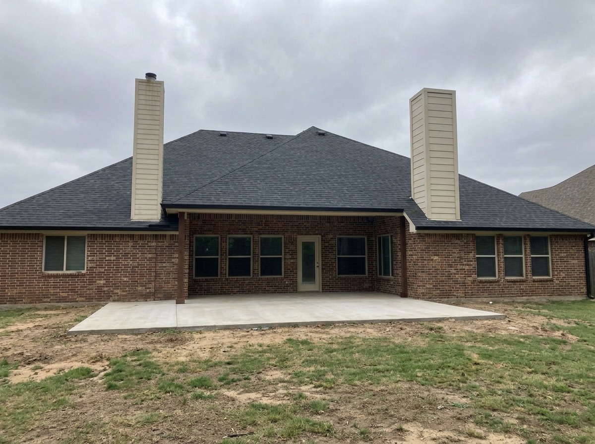 Backyard before a Legado covered outdoor living build